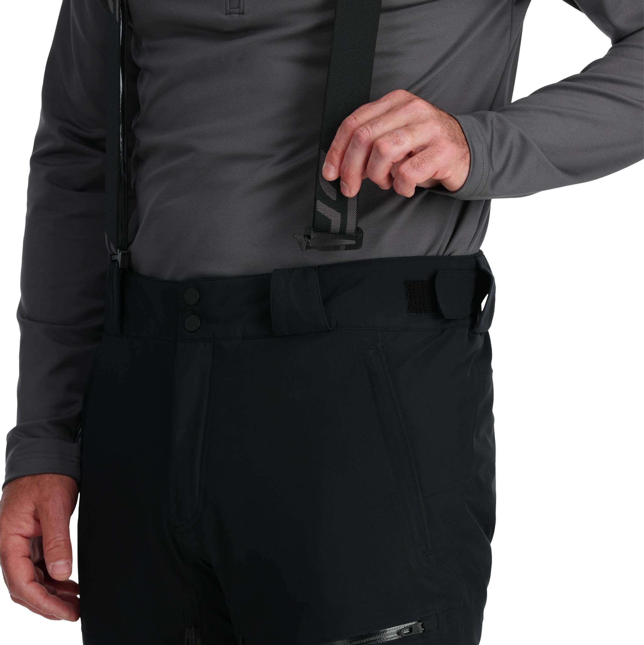 Spyder Men's Dare Insulated Pant Tall - Black pants with a subtle pattern of thin white lines on the left leg, and black hardware.