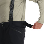 Spyder Men's Bormio Insulated Pants - Black pants with a zippered pocket on the right thigh and a black logo patch on the left leg.