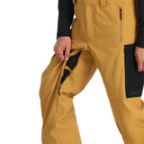 Spyder Men's Terrain Insulated Bib Pants - A pair of khaki-colored insulated bib pants with a black waistband and belt loops.