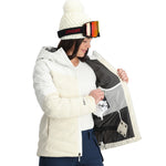 Spyder Women's Brisk Synthetic Down Jacket - A white down jacket with a hood, featuring black logos on the chest and sleeve.