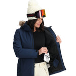Spyder Women's Skyline Insulated FF Jacket 2025 - A navy blue jacket with a fur-lined hood, featuring a zippered front and two side pockets.