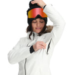 Spyder Women's Skyline Insulated FF Jacket - A white ski jacket with a fur-lined hood and black zippers.