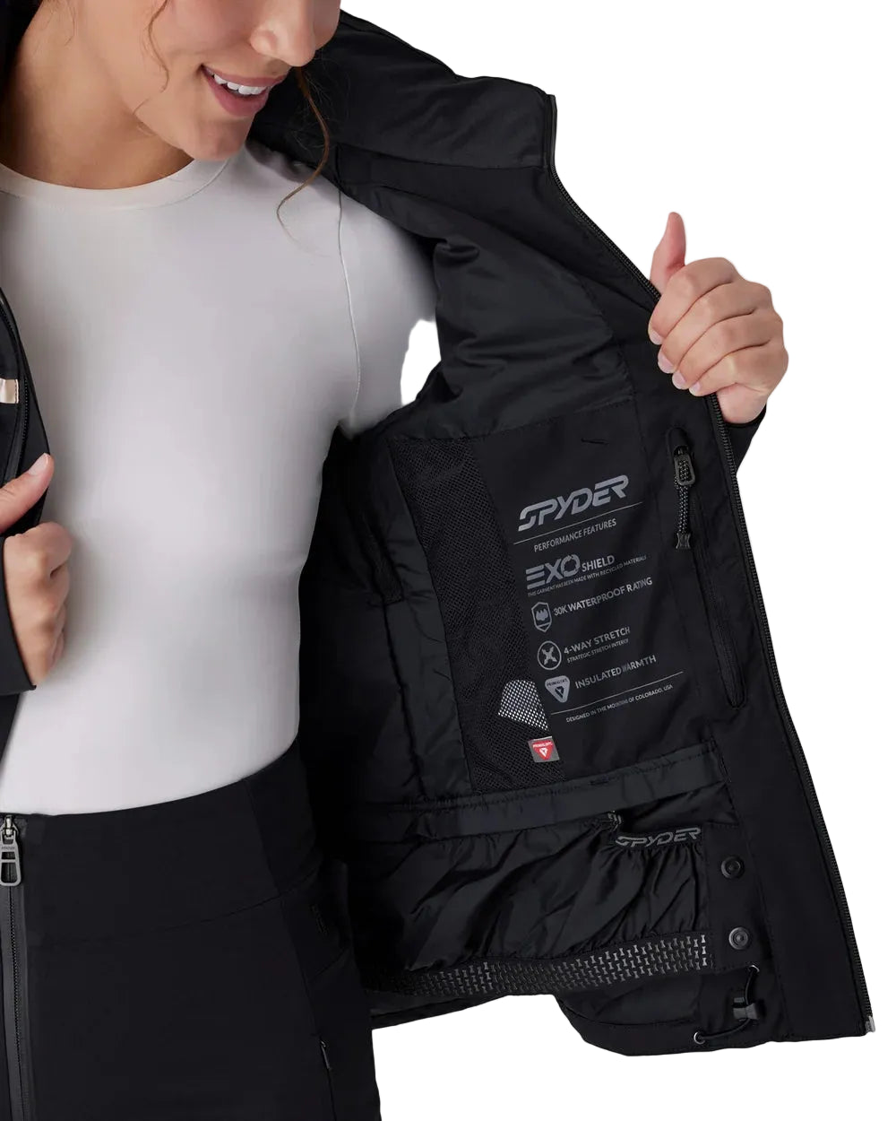 Women’s insulated black jacket with open front, interior pocket panel, logo details
