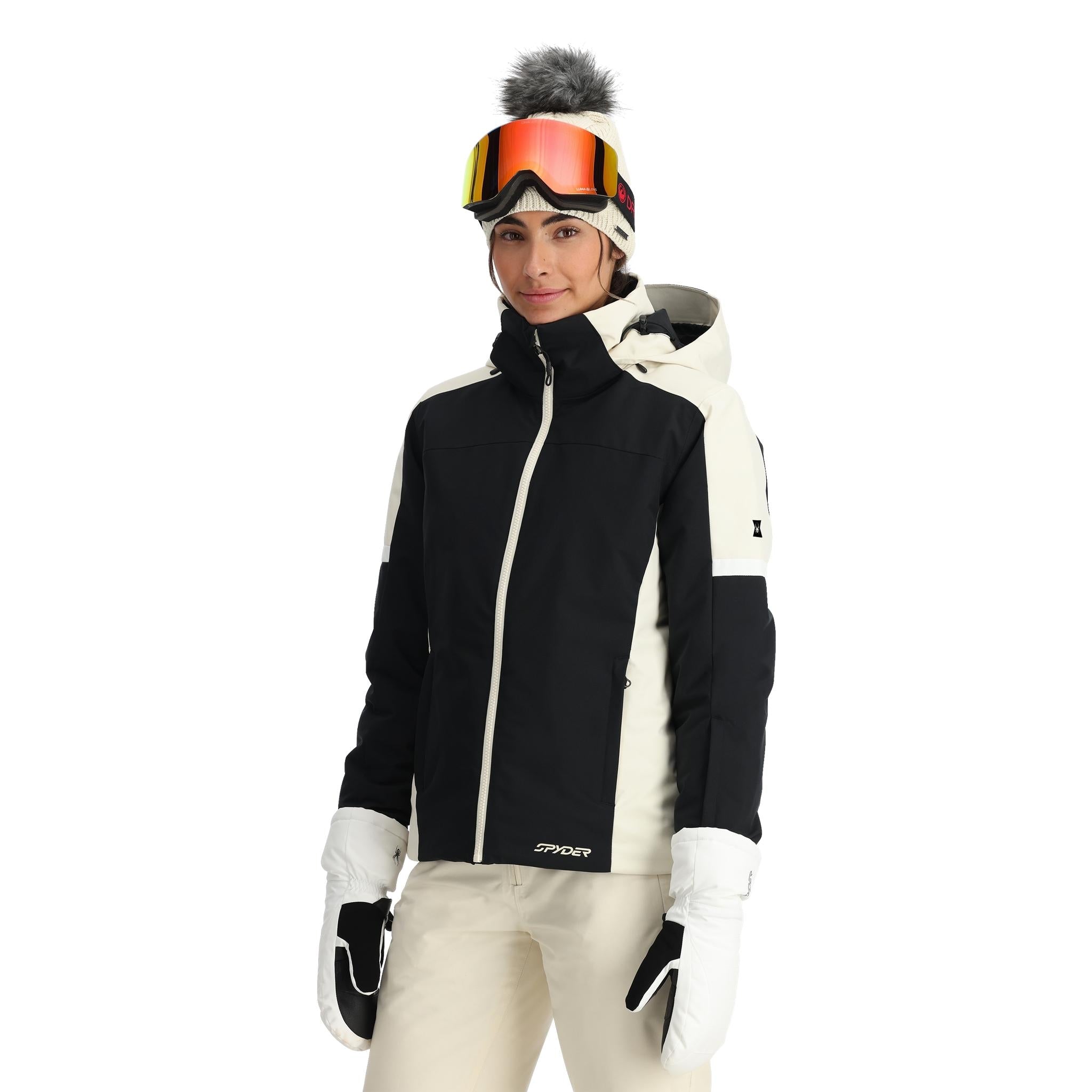 Spyder Women's Andorra Insulated Jacket 2025 - A black and white ski jacket with a zippered chest pocket, worn by a model on a plain background.