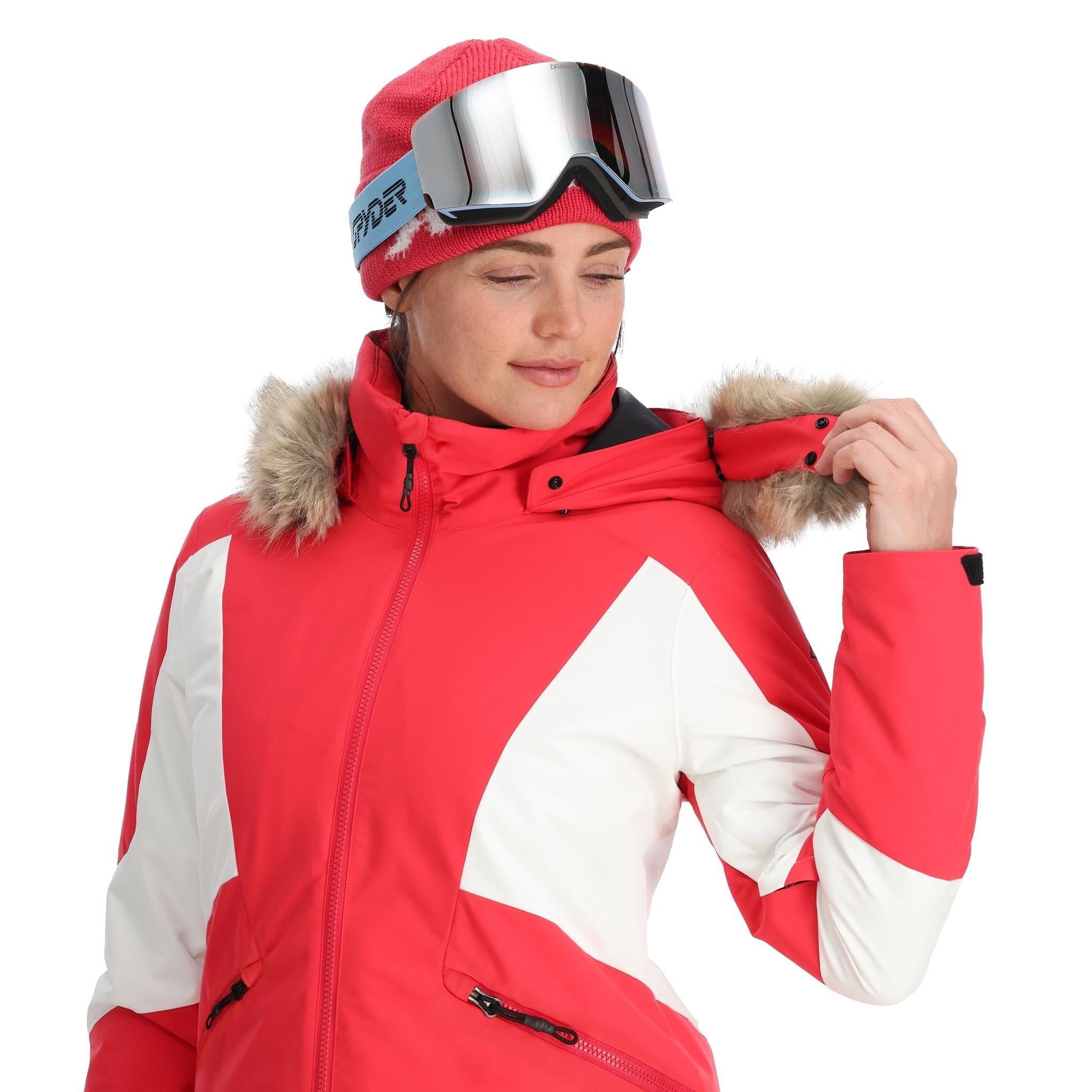 Spyder Women's Vida Insulated Faux Fur Jacket - A red and white jacket with a faux fur-lined hood, featuring a zipper closure and two zippered pockets on the front.