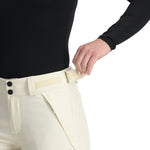 Spyder Women's Section Insulated Pants 2025 - Black insulated ski pants with a zippered pocket on the thigh and a white logo patch on the left leg.