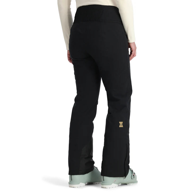 Spyder Women's Winner Insulated Pants 2025 - Black pants with a gold logo on the left leg, featuring a high waist and straight legs.