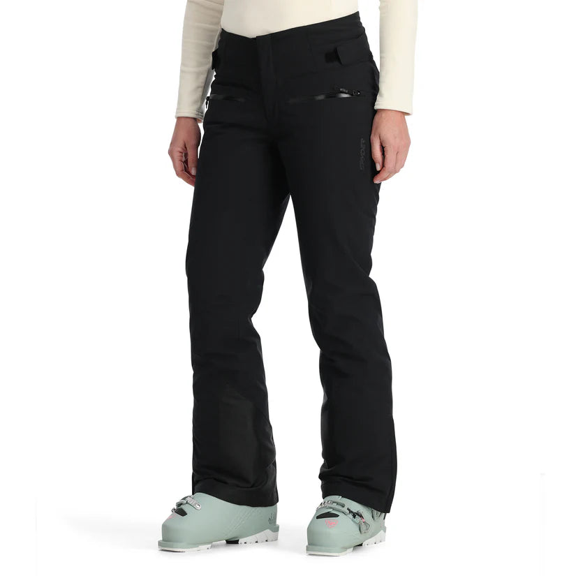 Spyder Women's Winner Insulated Pants 2025 - Black ski pants with a zippered pocket on the right thigh and adjustable Velcro straps at the waistband.
