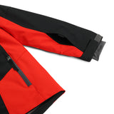 Spyder Boys' Turner Insulated Jacket 2025 - A black and red ski jacket with a zippered chest pocket, featuring a gray zipper pull.