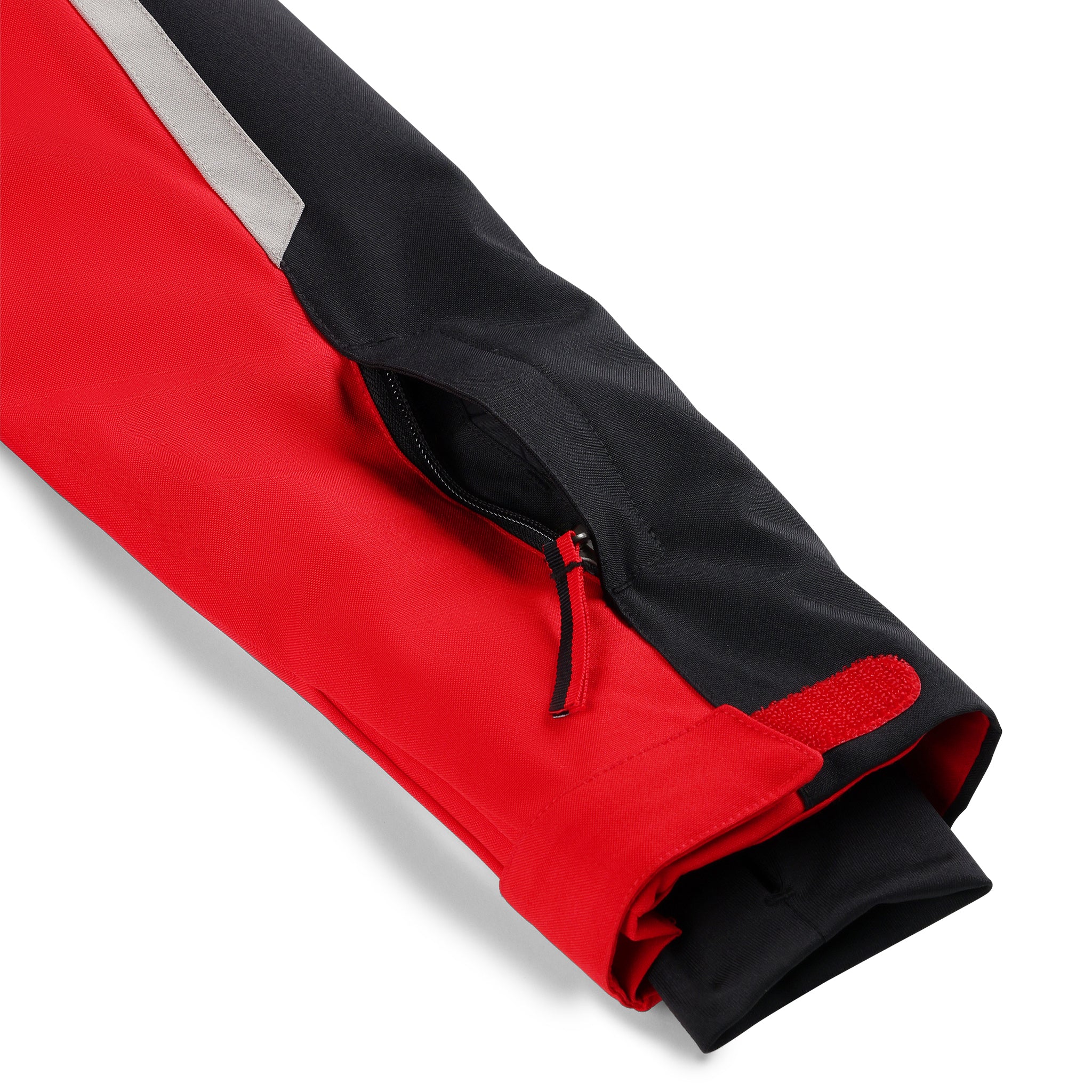 Spyder Boys' Leader Insulated Jacket 2025 - A red and black jacket with a white stripe on the shoulder, featuring a zipper closure and two pockets.