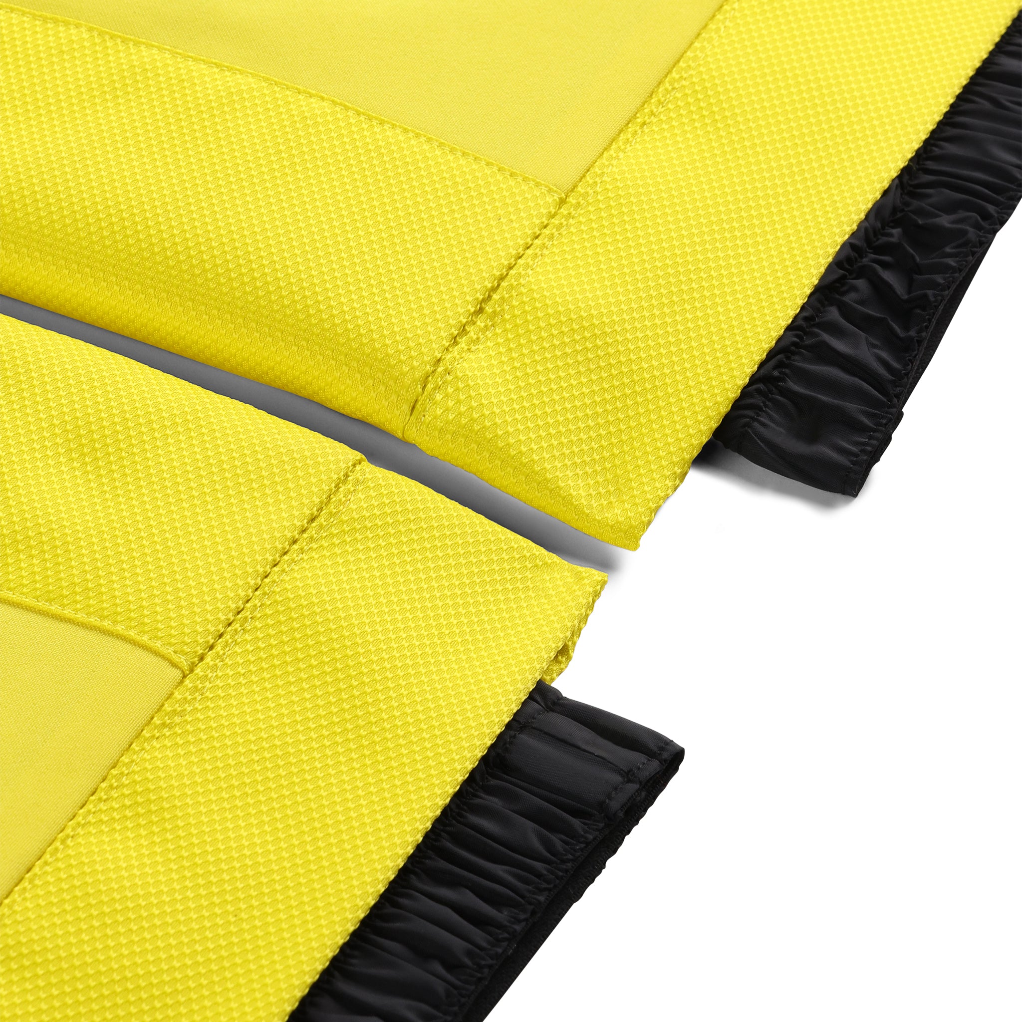 Spyder Junior Boys' Propulsion Insulated Pants 2025 - A pair of yellow ski pants with a textured pattern and black elastic cuffs at the ankles.