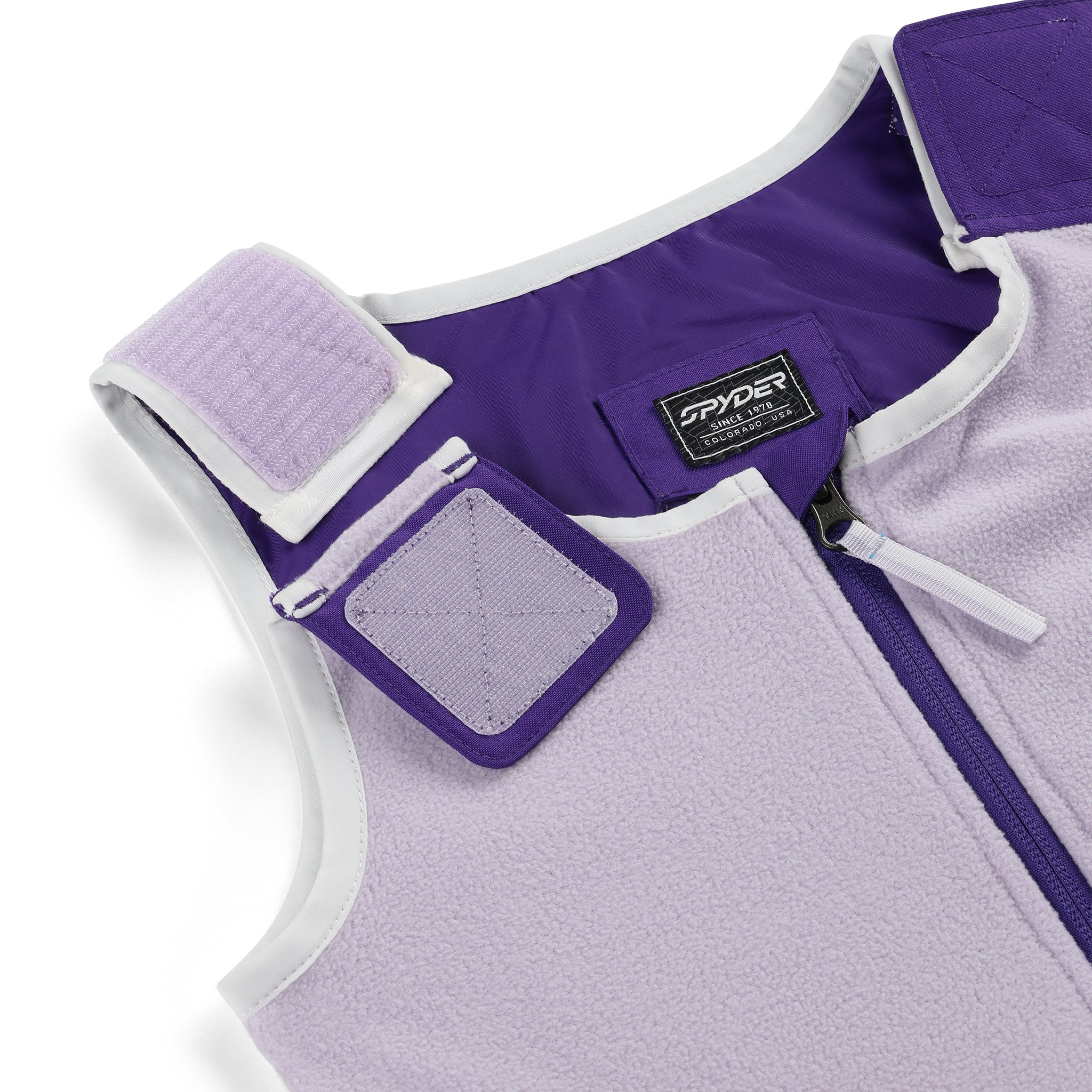 Spyder Girls' Expedition Insulated Bib Pant 2025 - A purple bib pant with a white trim and a black Spyder logo on the left leg.