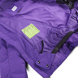 Spyder Girls' Zadie Synthetic Down Jacket 2025 - A purple jacket with a white logo on the left chest and black straps at the waist.