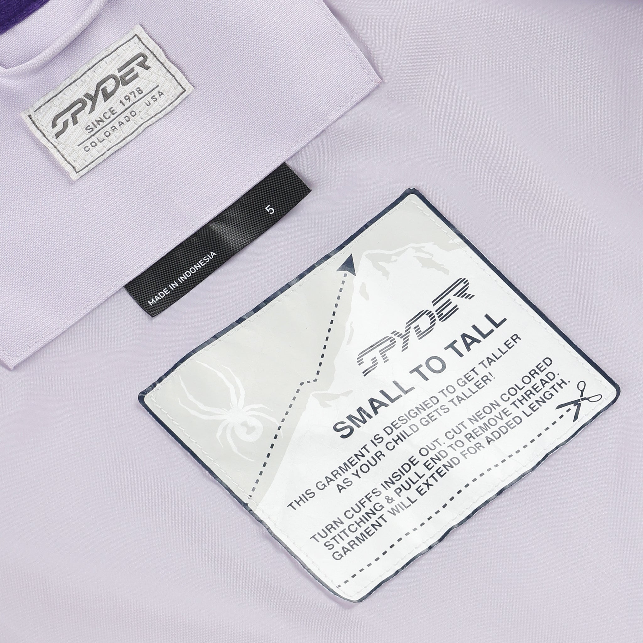 Spyder Girls' Lola Insulated Jacket 2025 - A light purple jacket with a white Spyder logo on the chest and a black zipper.