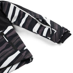 Spyder Youth Conquer Insulated Jacket 2025 - A black and white youth jacket with a zebra-like pattern, featuring a zipper closure on the front.