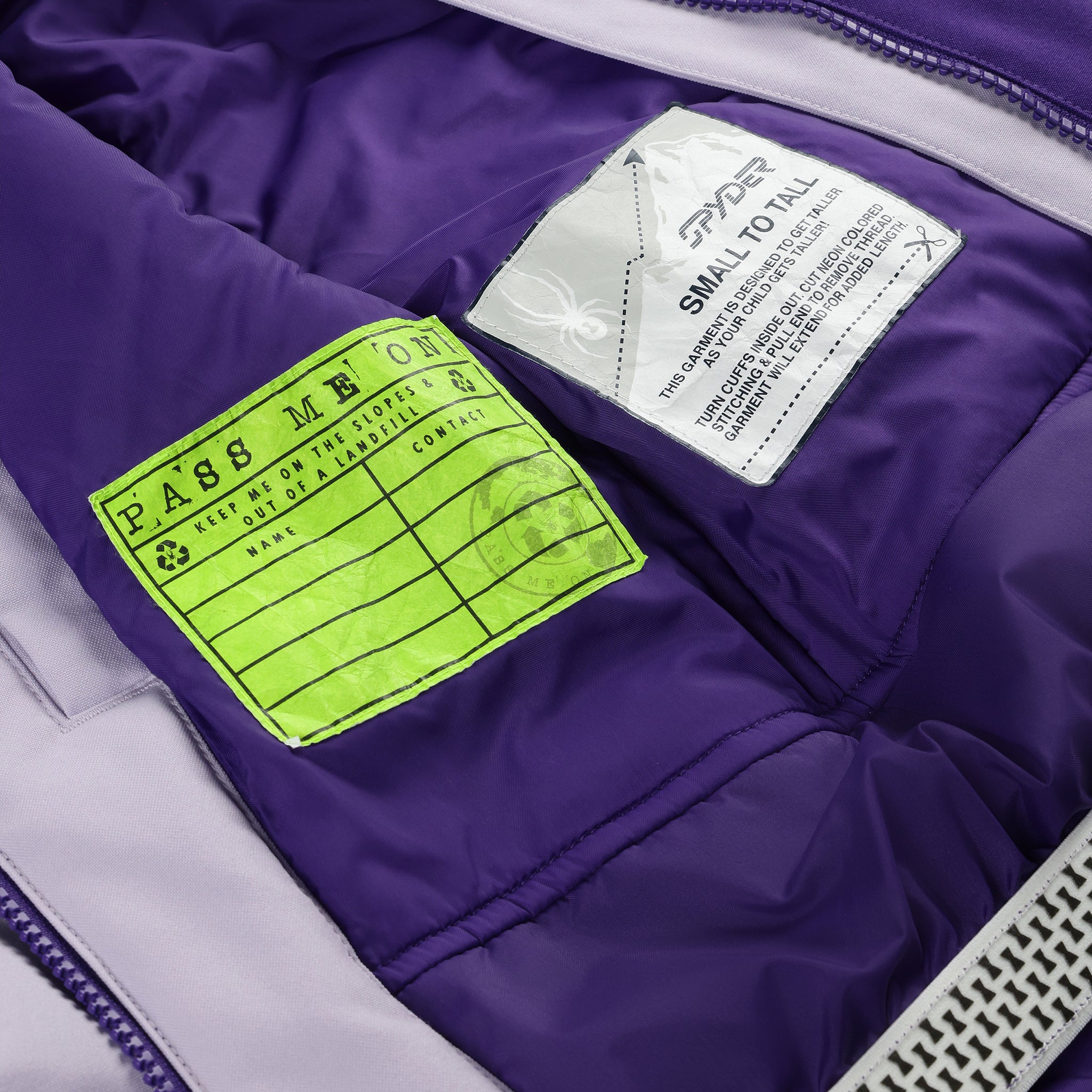 Spyder Youth Conquer Insulated Jacket 2025 - A purple jacket with a white logo on the left chest and a zipper closure.