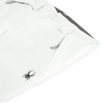 Spyder Junior Girls' Revel Insulated Pants 2025 - White ski pants with a black spider logo on the left leg.