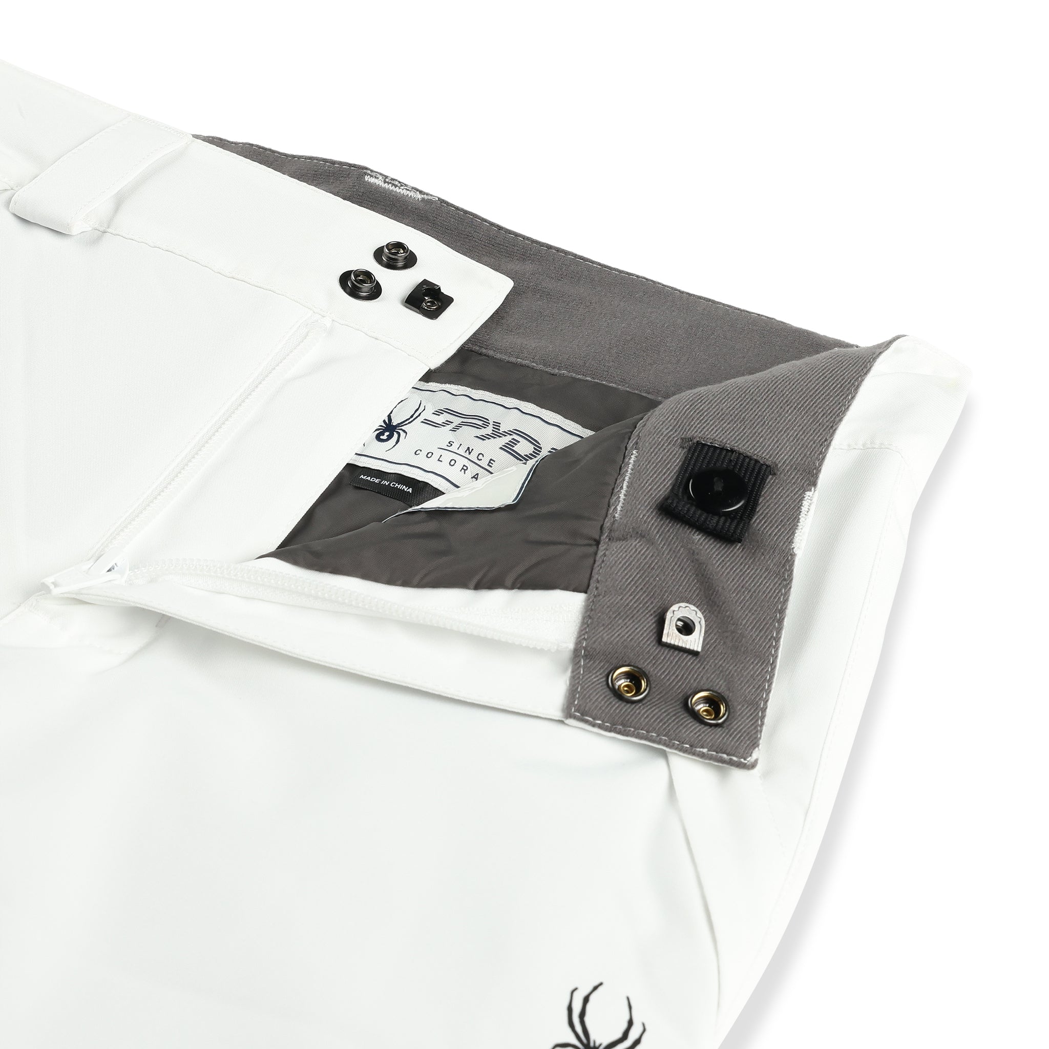 Spyder Junior Girls' Revel Insulated Pants 2025 - White snow pants with black logo on left leg, gray interior lining and belt loops.