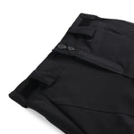Spyder Girls' Olympia Insulated Pant 2025 - Black ski pants with a subtle pattern of thin white lines on the left leg, featuring two silver buttons and black elastic cuffs at the ankles.