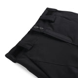 Spyder Girls' Olympia Insulated Pant 2025 - Black ski pants with a subtle pattern of thin white lines on the left leg, featuring two silver buttons and black elastic cuffs at the ankles.