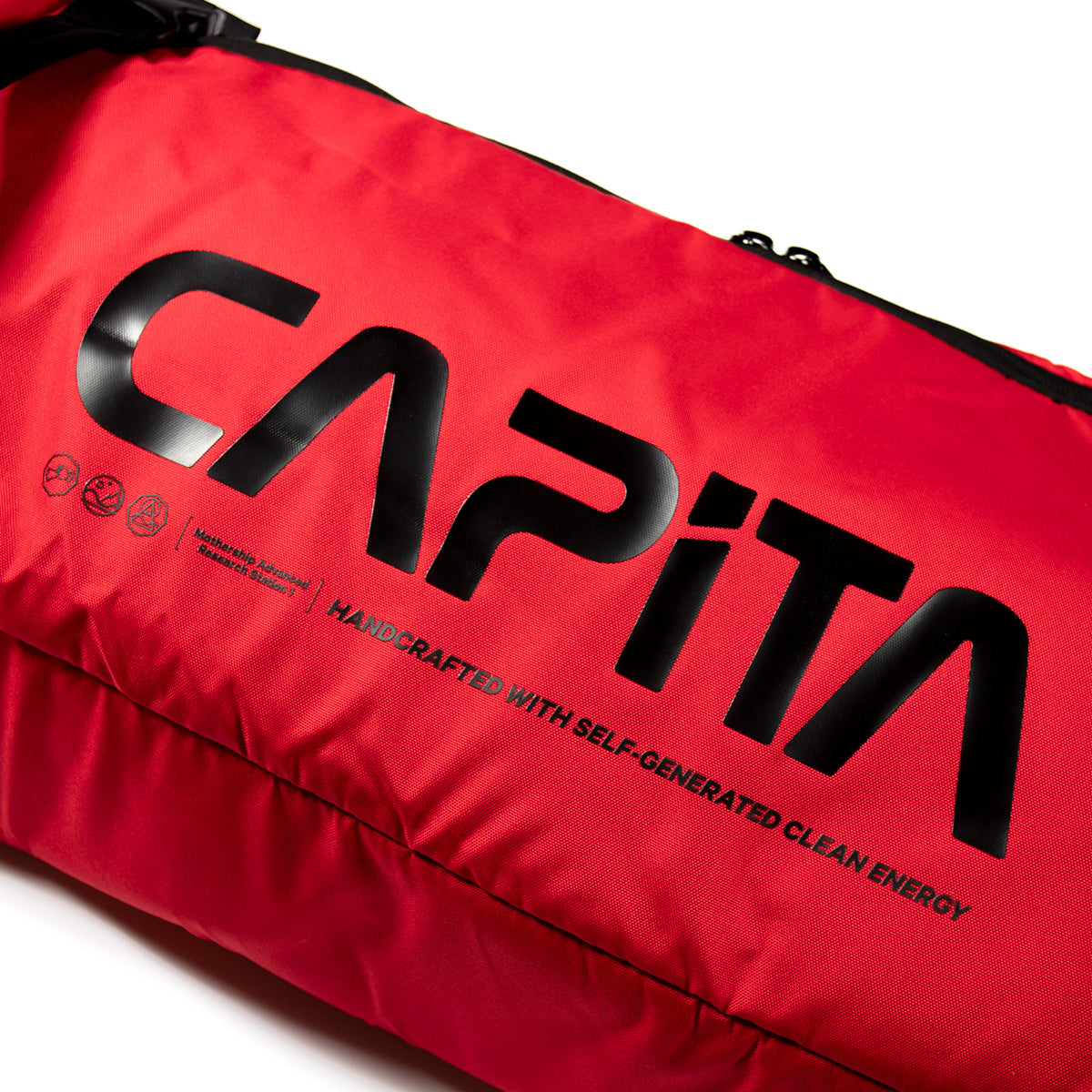 CAPiTA - Explorer Wheeled Snowboard Bag 2026 is shown in a red color with black hardware and white lettering.