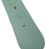 Arbor Formula Decon 2026 - A light green snowboard with a brown stripe down the middle and small black dots on either side of it.