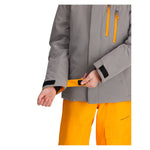 Obermeyer Junior's Insulated Gentleman's Jacket - A grey jacket with a black zipper and orange accents on the cuffs, worn by an unseen model.