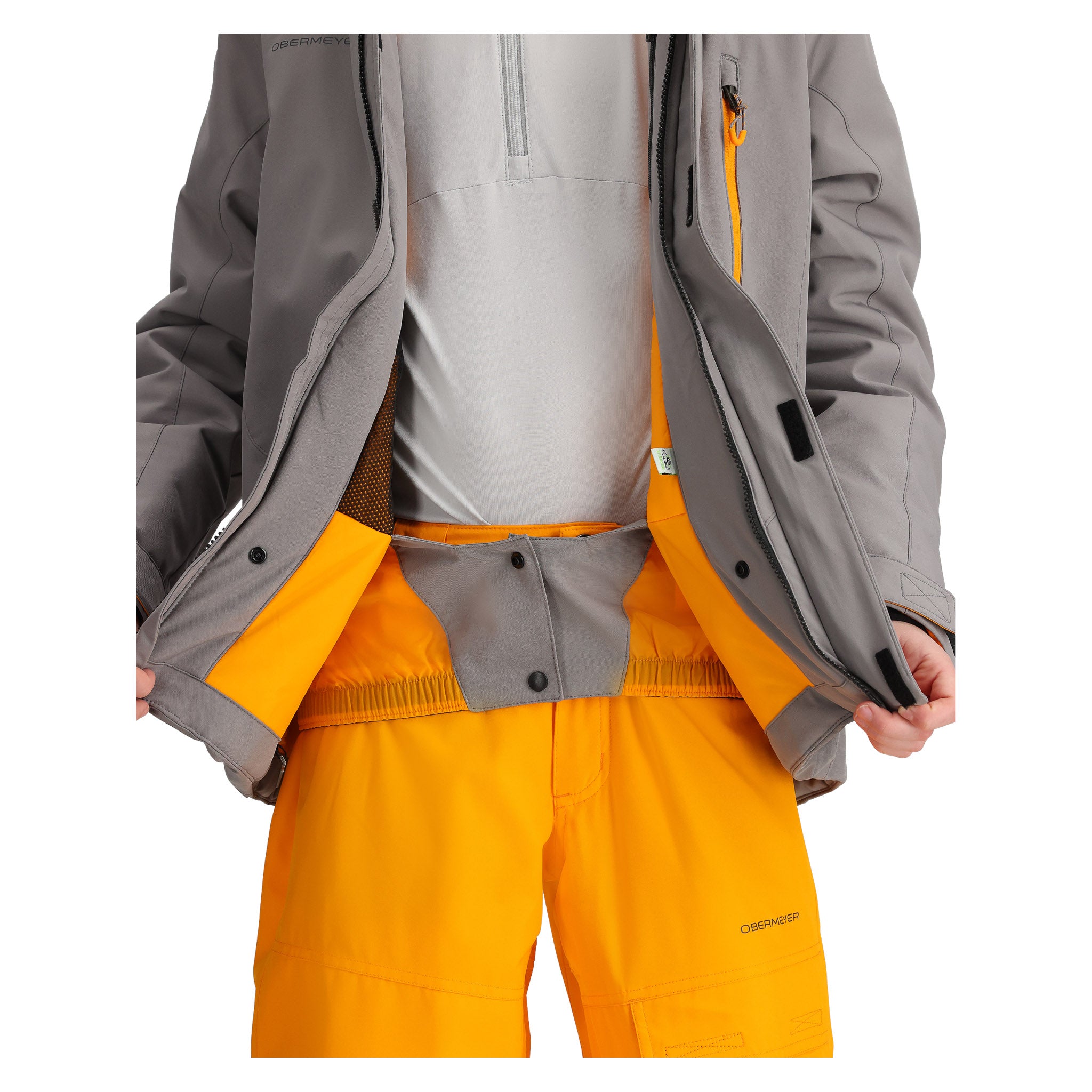 Obermeyer Junior's Insulated Gentleman's Jacket - A grey and orange insulated jacket with a zippered front, worn by an unseen model.
