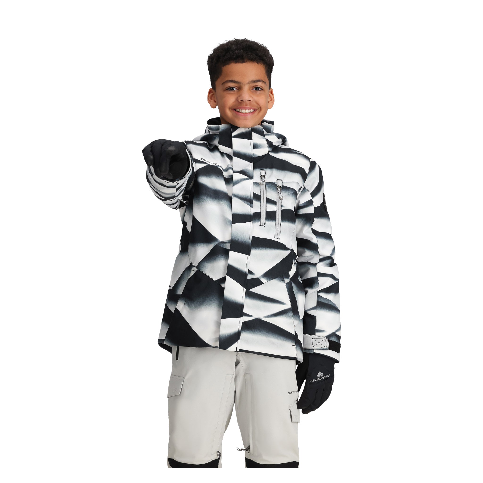 Obermeyer Junior's Insulated Gent's Jacket 2025 - A black and white snowboard jacket with a geometric pattern, featuring a zippered chest pocket and adjustable cuffs.