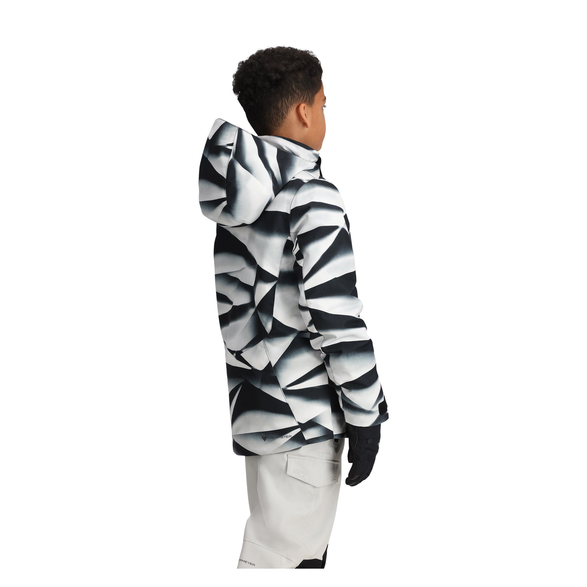Obermeyer Junior's Insulated Gent's Jacket 2025 - A black and white jacket with a geometric pattern, featuring a hood and long sleeves.