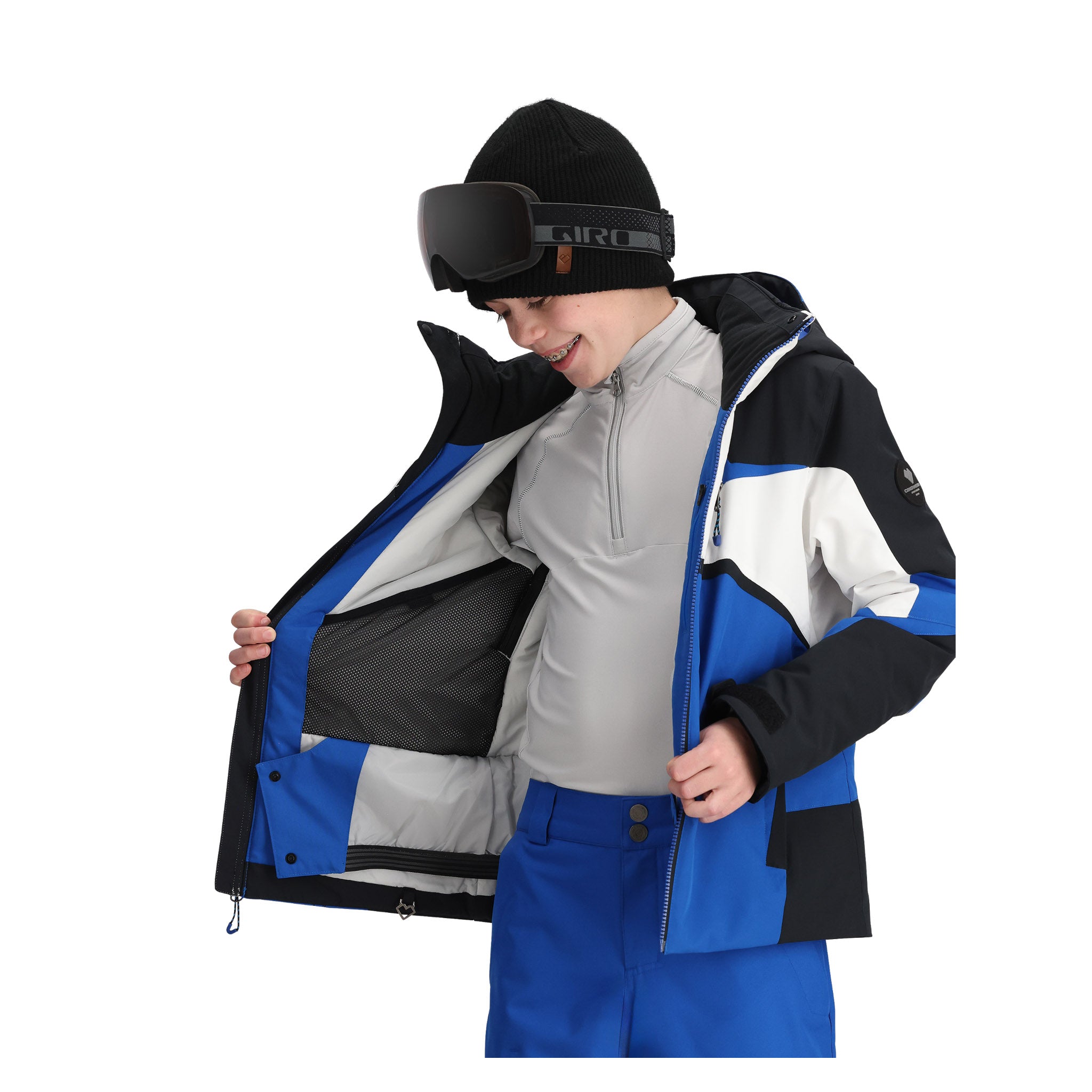 Obermeyer Juniors Mach 15 Insulated Jacket - A black, blue, and white ski jacket with a zippered chest pocket and two zippered side pockets.