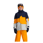 Obermeyer Junior's Axel Insulated Jacket 2025 - A navy blue and orange jacket with a zippered chest pocket, worn by a model on a plain white background.