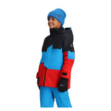 Obermeyer Junior's Axel Insulated Jacket 2025 - A black, red and blue jacket with a hood on a young boy wearing it.