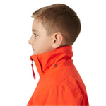 Helly Hansen Junior's Traverse Insulated Jacket - A bright orange jacket with a black zipper and two black buttons on the left side of the chest.