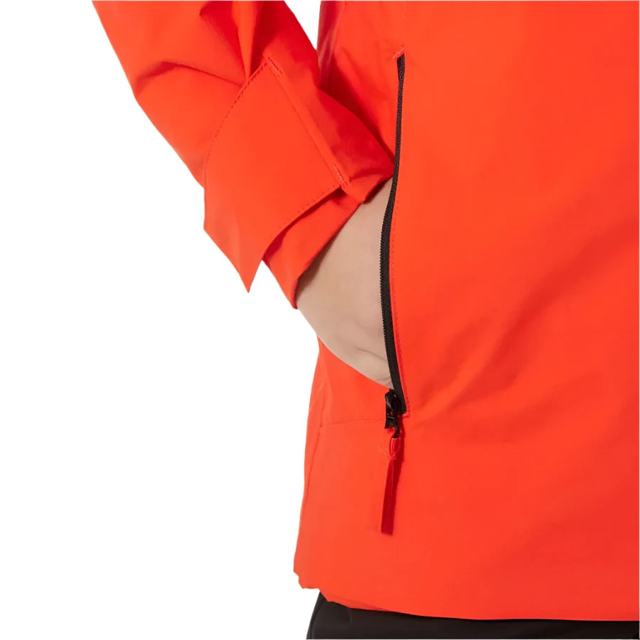 Helly Hansen Junior's Traverse Insulated Jacket 2025 - A bright orange jacket with a black zipper on the left side, featuring a beige lining visible through the opening.