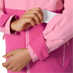Helly Hansen Junior's Traverse Insulated Jacket - A pink insulated jacket with a hood, featuring a zipper and two pockets on the front.