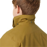 Helly Hansen Junior's Traverse Insulated Jacket 2025 - A dark brown jacket with a hood, featuring two black snap buttons on the collar.