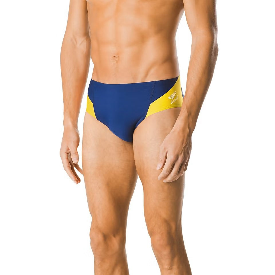 Speedo Spark Splice Brief Swimsuit - A navy blue brief with a yellow stripe down the side and white logo on the front.