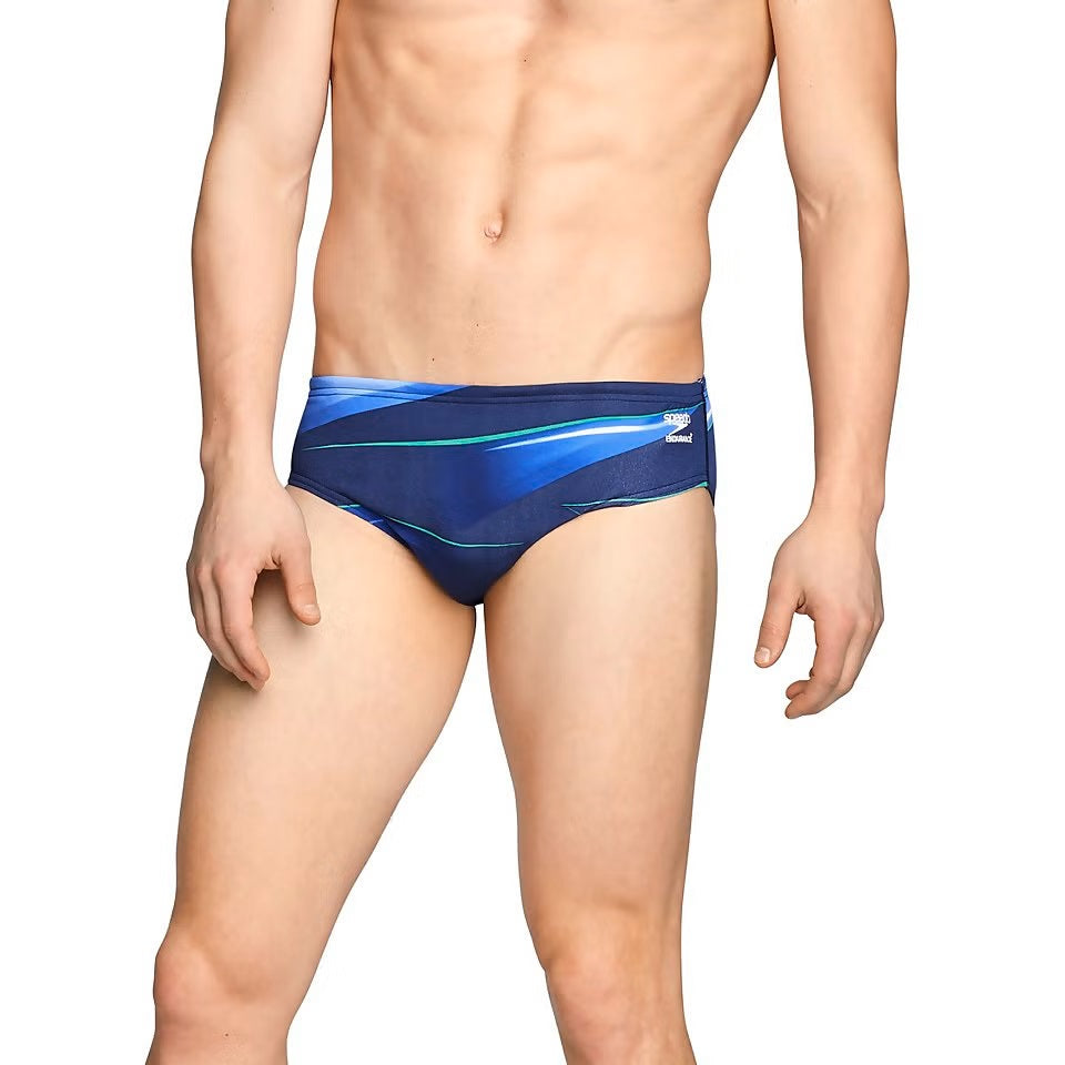 Speedo Infinite Pulse Brief Swimsuit - A navy blue swimsuit with a geometric pattern of light blue and white lines.
