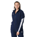 Speedo Women's Edge Warm Up Jacket - A navy blue jacket with a white logo on the left chest and two zippered pockets on either side.