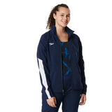 Speedo Women's Edge Warm Up Jacket - A navy blue jacket with a white logo on the left chest and two zippered pockets on either side.