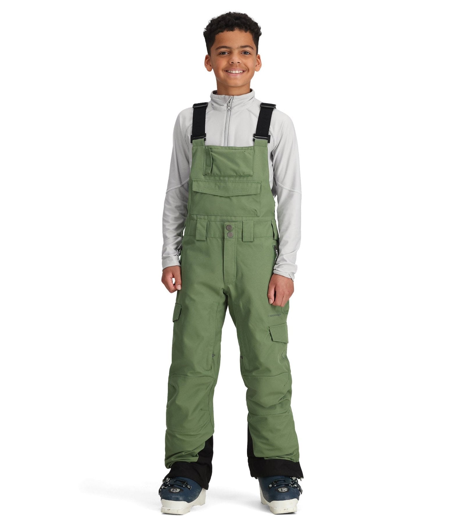 Obermeyer Junior's Carver Bib Pant 2025 - Olive green bib pants with adjustable straps and multiple pockets.