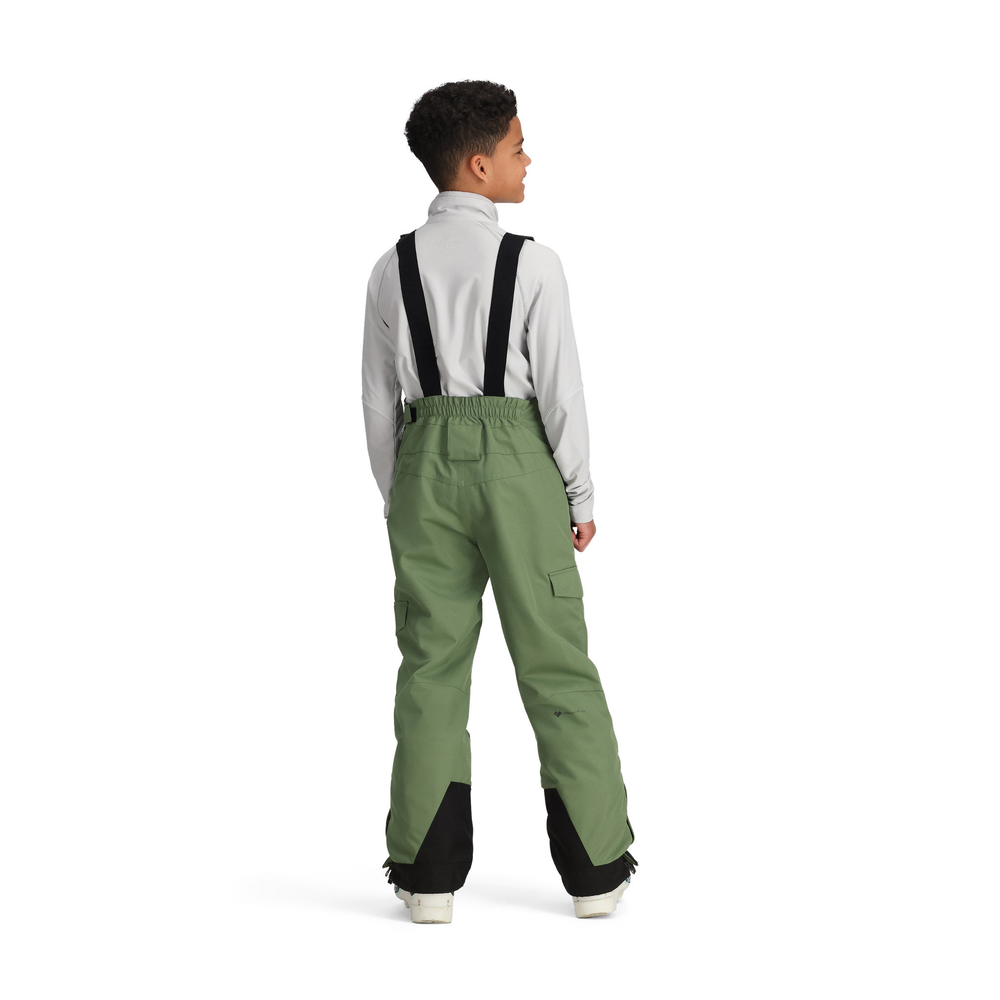 Obermeyer Junior's Carver Bib Pant 2025 - A pair of olive green snow pants with black trim and a zippered pocket on the thigh.