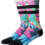 Stance Gloww Poly Crew Socks 2025 - A pair of crew socks in a vibrant, neon-colored design with a repeating pattern of abstract shapes and lines.