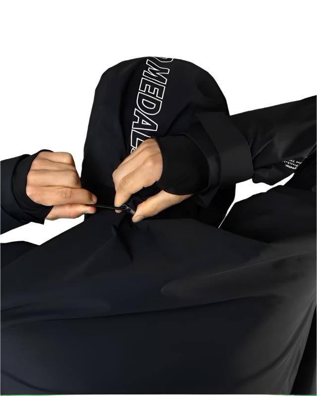 Beyond Medals Fullzip Insulated Jacket 2025 - A black jacket with white lettering on the sleeve and a zipper running down the front.