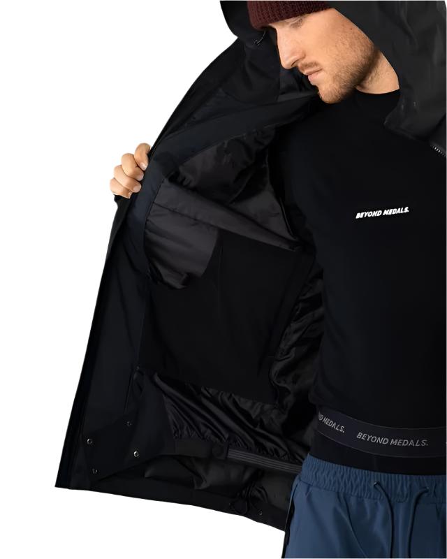 Beyond Medals Fullzip Insulated Jacket 2025 - A black insulated jacket with a full zip and two pockets on either side, worn by a model in this image.