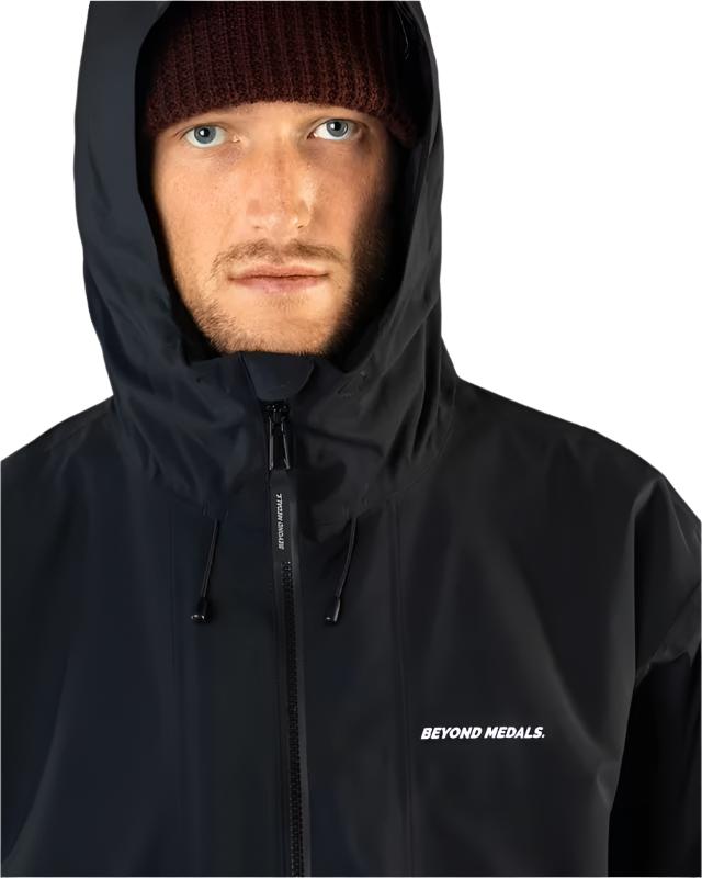 Beyond Medals Fullzip Insulated Jacket 2025 - A black jacket with a zippered front and hood, featuring white lettering on the chest.