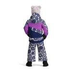 Obermeyer Junior's Carnia Insulated Jacket 2025 - A navy blue jacket with a white snowflake pattern and a hood, worn by a model on a plain background.