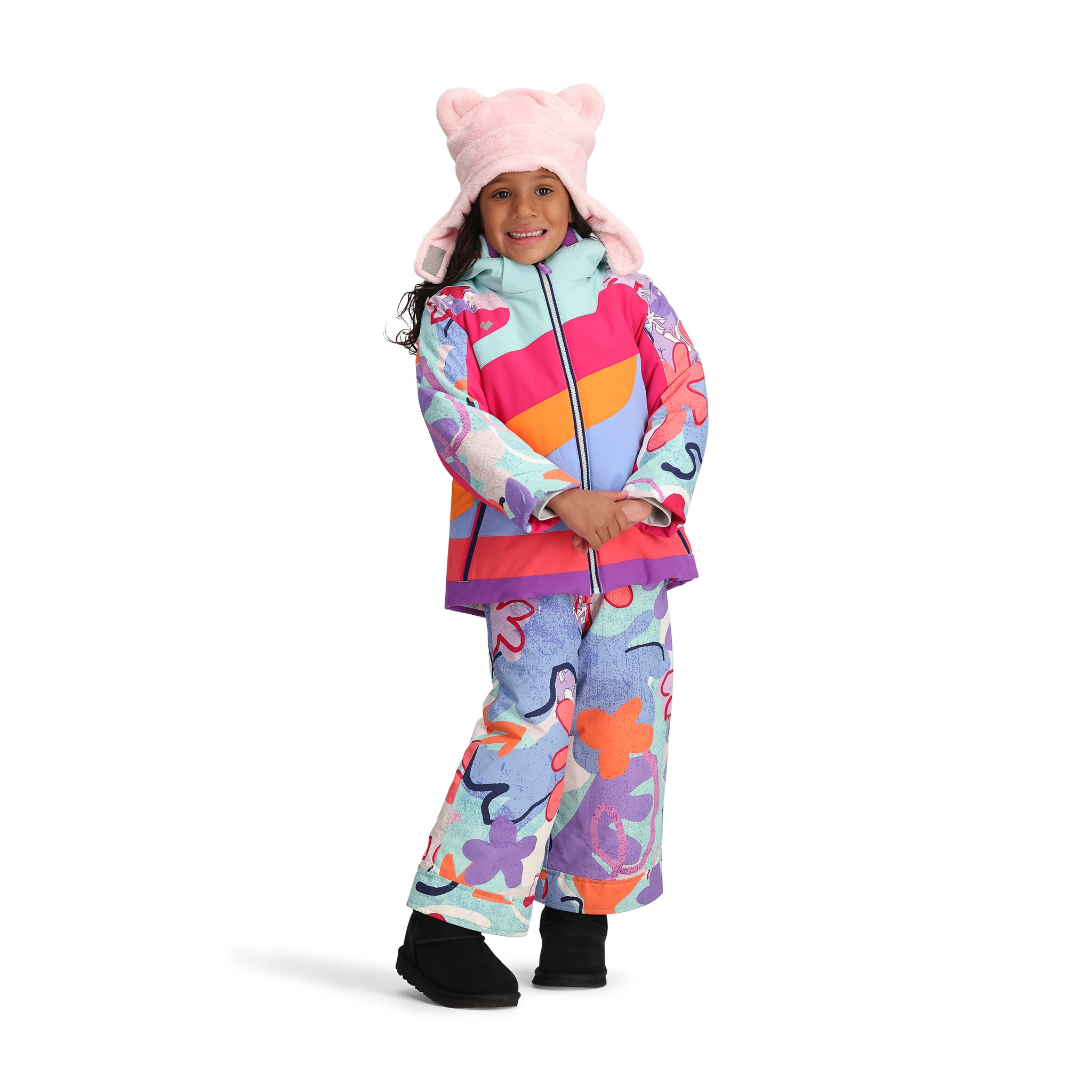 Obermeyer Junior's Carnia Insulated Jacket 2025 - A pastel blue jacket with a white snowflake pattern and purple trim, worn by a young girl in front of a light gray background.