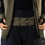 Beyond Medals Cargo Shell 2L Jacket 2025 - A khaki-colored jacket with a black zipper and two chest pockets, featuring a cargo pocket on one side.